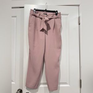 Express
High Waisted Paperbag Ankle
Pant
Size: 8 Short
Color: Pale Pink